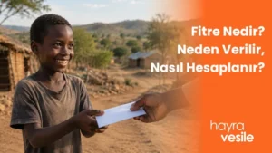 Afrikalı bir çocuğa zekat yardımı için zarf uzatılması ve yanında 'Fitre Nedir? Nasıl Hesaplanır ,Kimlere Verilir' başlığı